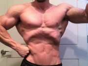 Jacked bodybuilder Benji Bastian flexing his huge, shredded, muscles
