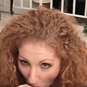 Sexy redhead gives you the perfect POV blowjob