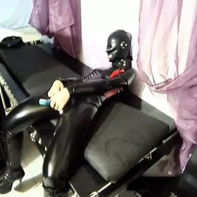 Latex trio submissively fucks each other in the cunt with their rubber dildos