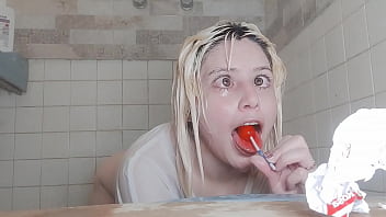 Wet t-shirt with lollipop in the shower