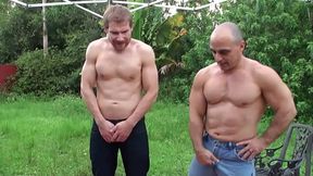 Two Muscle Studs Pissing