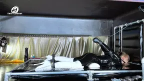 Bound Kira in latex catsuit gets pissed on while facesitting