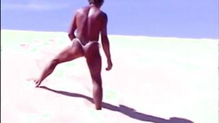 Tanned guy on beach in tiny string thong (temporarily!)