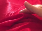Man In Latex Catsuit Rubbing Cock With Satin Sheets