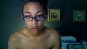 Ebony girl in glasses exposes her body for the webcam