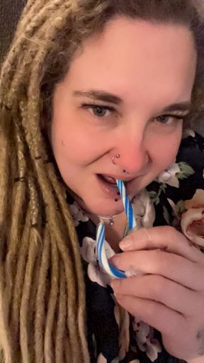 Erotic tease. Licking, sucking, and deep throating a candy cane. You only wish it could be you.