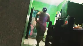 chubby mexican wife preparing dinner in the kitchen