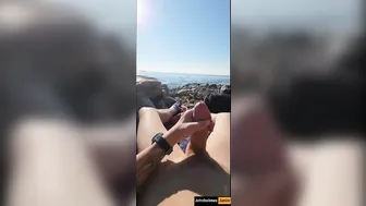 JohnHolmesJunior shoots a massive cum load at nude beach with onlookers