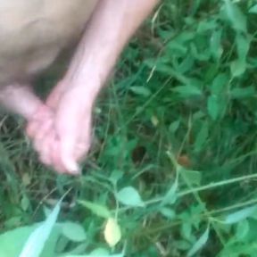 Outside in a field naked jacking off