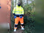 quick pawing off in hi-vis tracksuit and sneakers outdoors