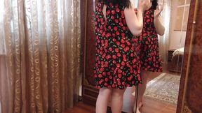 beautiful pregnant anna tries on a dress near the mirror