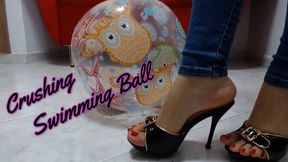 crushing a swimming ball with sexy heels