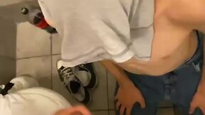 Public toilet: twink sucking big dick