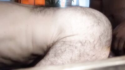 Bald guy sucks a big black cock and takes it up his hairy ass