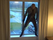 silicone masked wetsuited guy gets horny at hotel window and humps his pillows