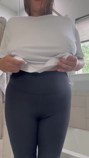 Woman in white shirt removing it