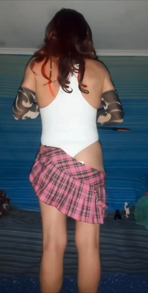 Sliding off my tartan mini to spank myself in white swimsuit