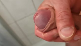 Close-up uncut male masturbation with squirting, peeing, and creamy cumshot