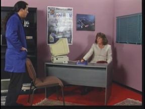Mature brunette sucks and takes cock by desk at work