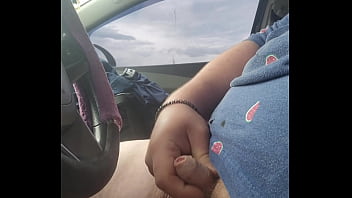 Tugging my cock on the highway