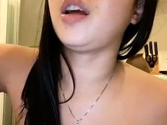 pretty thai woman masturbating with rubber chicken toy