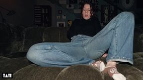 Cute 18-year-old girl fingered and moaning on the sofa