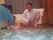 Very skinny teen in white long sleeve shirt strokes his cock
