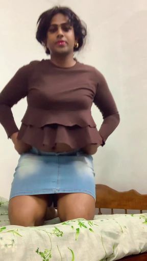 Cute girl in ruffled top and denim skirt