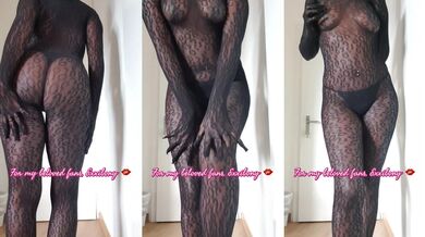 Ebony milf in fishnet bodysuit dances with big tits flopping