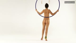 Brunette Kim Nadara in yellow socks doing acrobatics