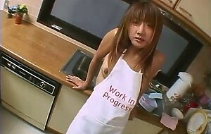 Teen clad only in apron fucked in the kitchen