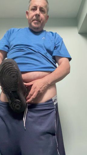 Rick Crete licking Nathaniel's black runners