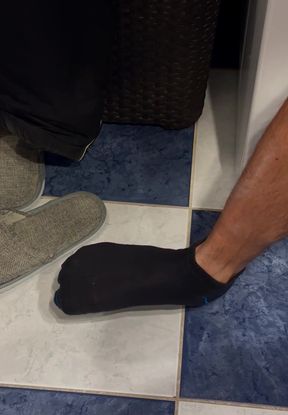 Cute twink shows off his feet and socks in a solo video