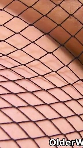Big Titted MILF Samantha Sanders From the UK Fingers Her Cunny in Fishnet Tights