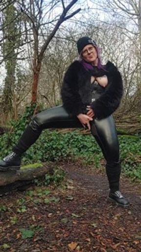 MILF pissing  in shiny pants shows off boob tattoo