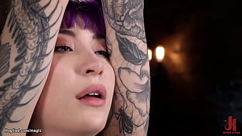 Tattooed slave Charlotte Sartre is bound in standing position with one leg bent in knees gets fingered and whipped then pussy fucked with dildo on a stick by master The Pope on hogtied