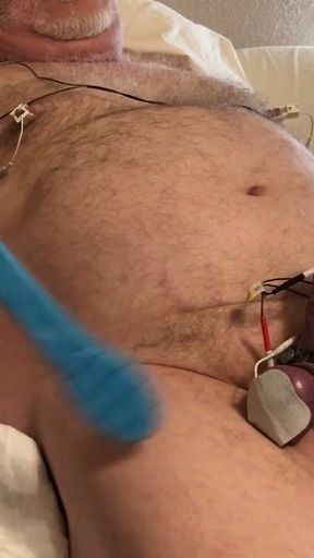 Balls and cock tightly bound, then estimmed as they swell up. Hands free orgasm.   Clip 1