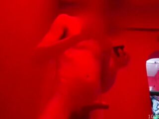 Interracial sex filmed in a dimly lit badhouse