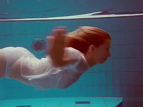 Cute Melissa plays underwater