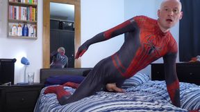 Jonathan in Spiderman costume masturbating his erect uncut cock horny to play