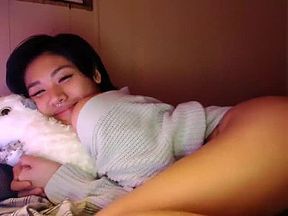 Asian teen plays with toys on webcam 03