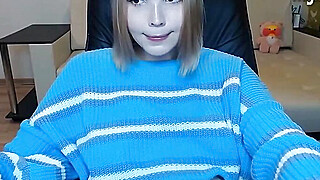 pretty shemale cutie with blue sweater tugging her tiny cock