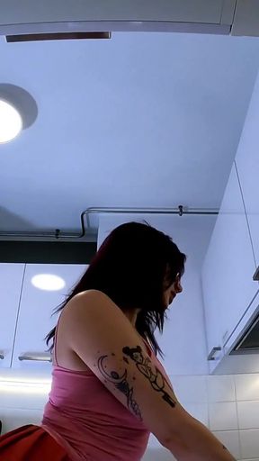 Stunning moment from &quot;Hottest redhead tattooed cheerleader with over knee socks shows her see through panties in the kitchen&quot;