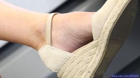Hot foot admiration in crossed legs pose