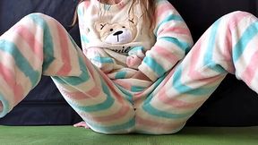 Horny girl in pajamas plays with herself and squirts