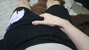 Guy Strokes His Dick Through His Shorts