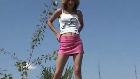 Messy haired amateur chick flashes her sexy thighs as she pisses outdoors