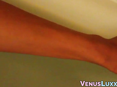 Beautiful ladyboy tending to her amazing body and shaft