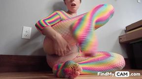 Teen in Rainbow Fishnets Fingers Herself