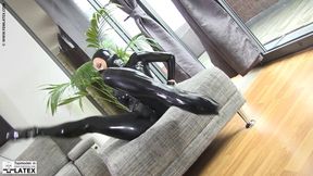 Large flexible woman in latex as a flexible doll